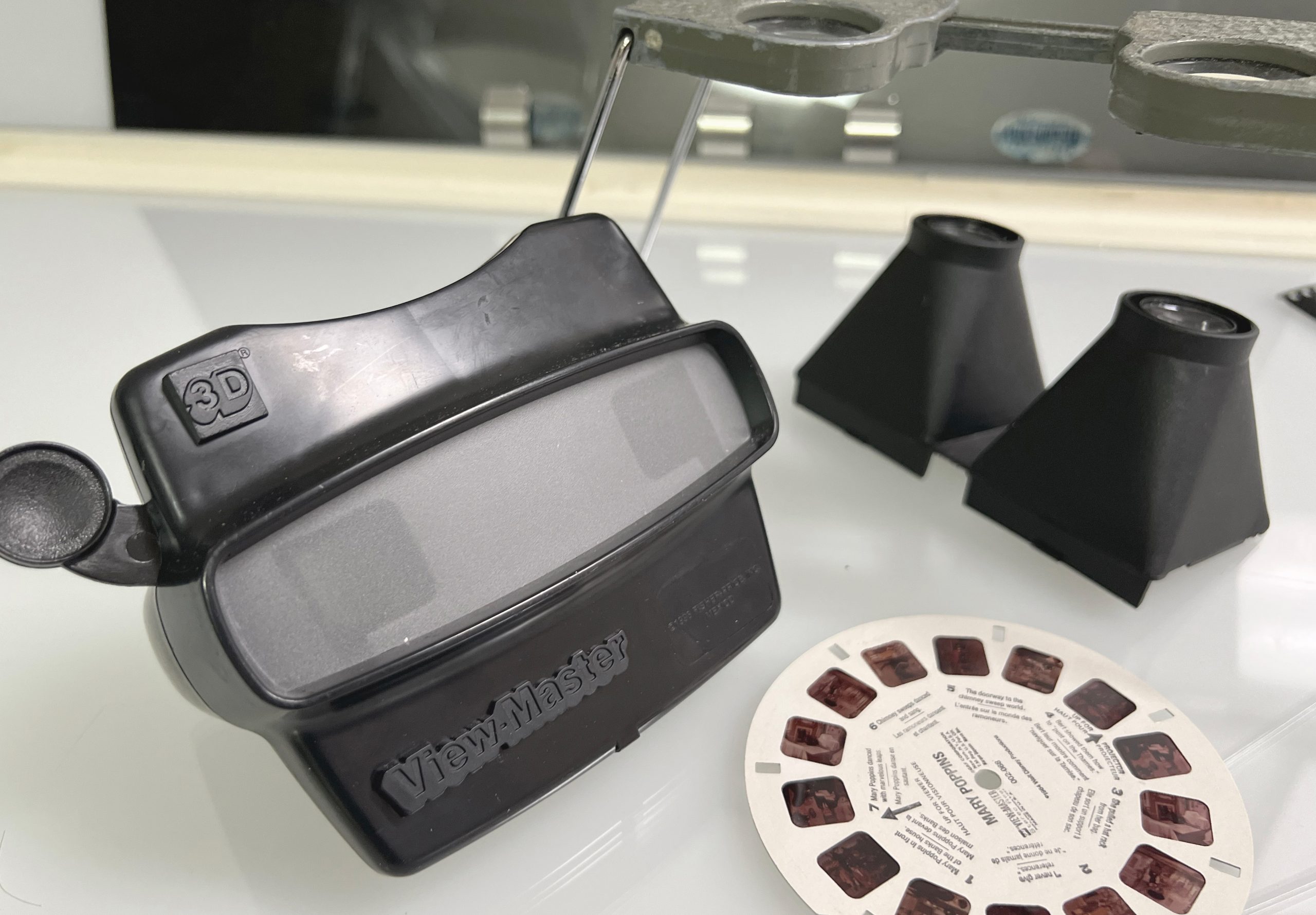 View-Master viewer with commercial slide disc and stereoscopic viewers for unprocessed film. 