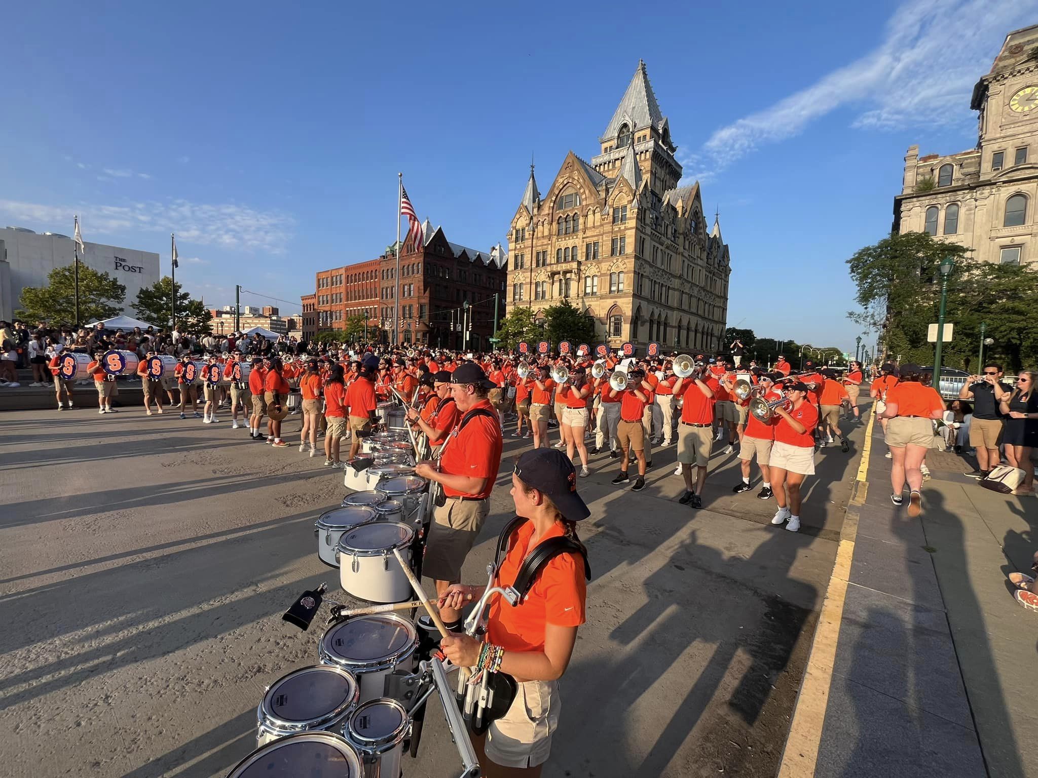 A university band performs in downtown Syracuse.