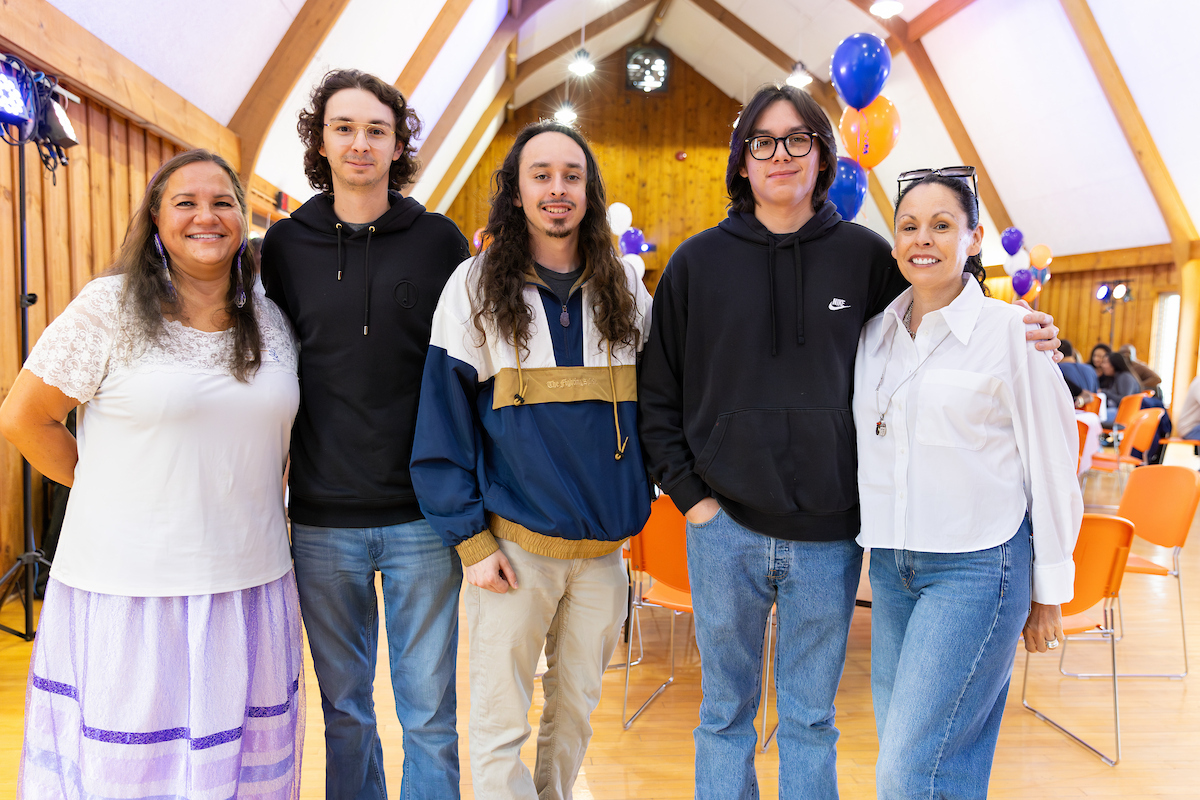 Five people standing together 