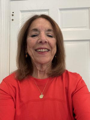 A woman smiles for a portrait photo.