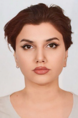 A woman poses for a headshot.