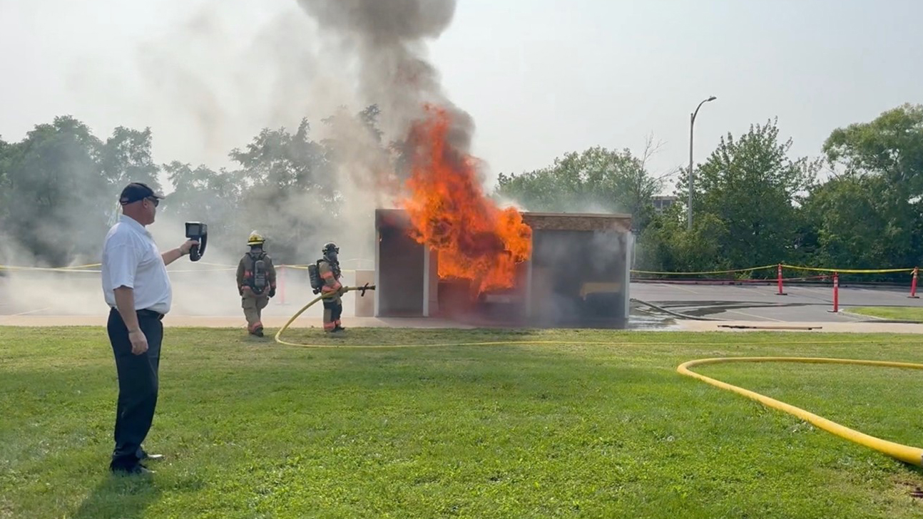 Firefighters extinguish a fire during an exercise