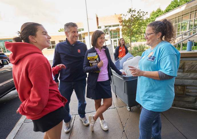 Kathryn Bradford welcoming a family to Day Hall