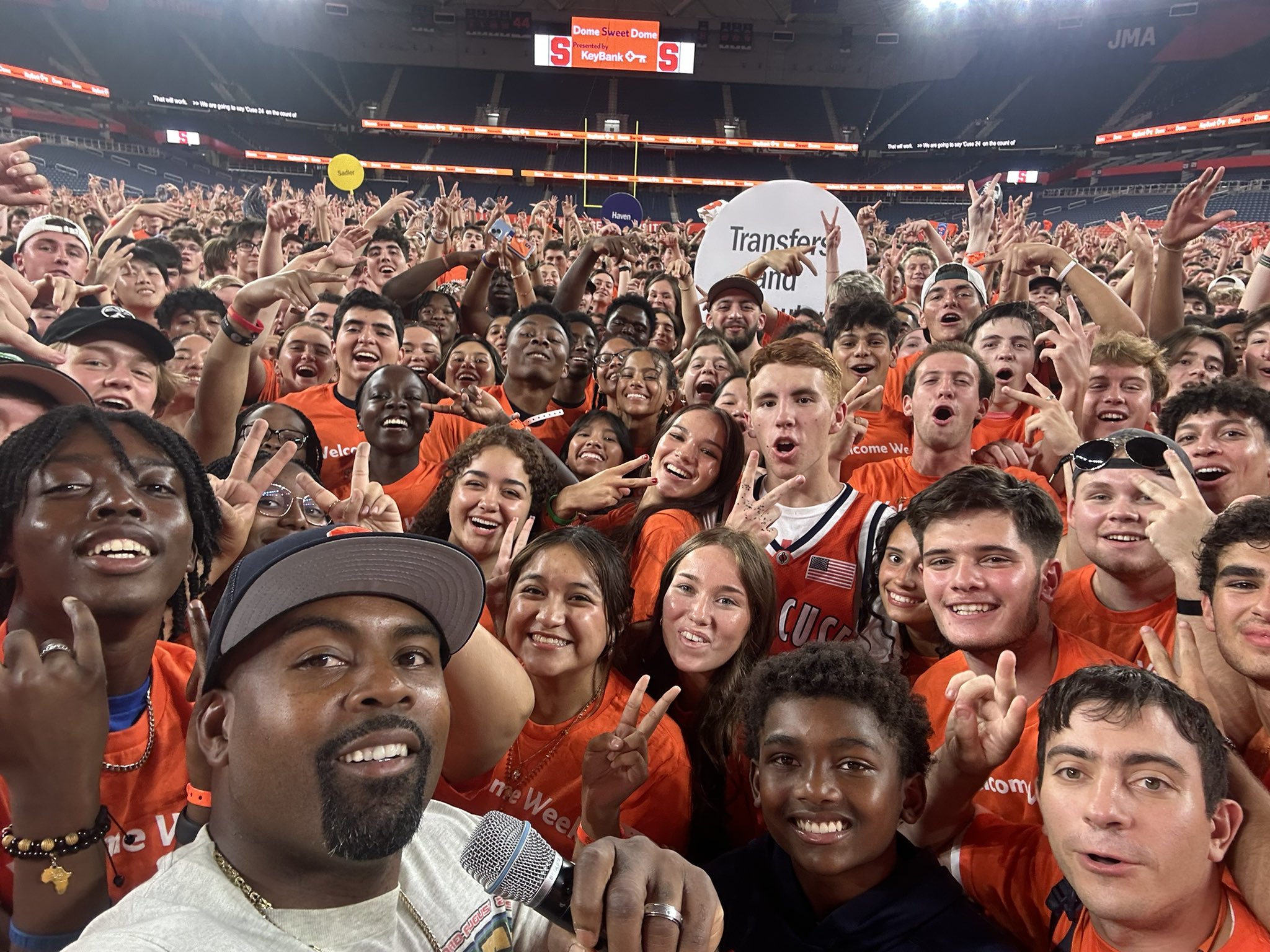 Coach Fran Brown takes a selfie with the students in the JMA Dome. 