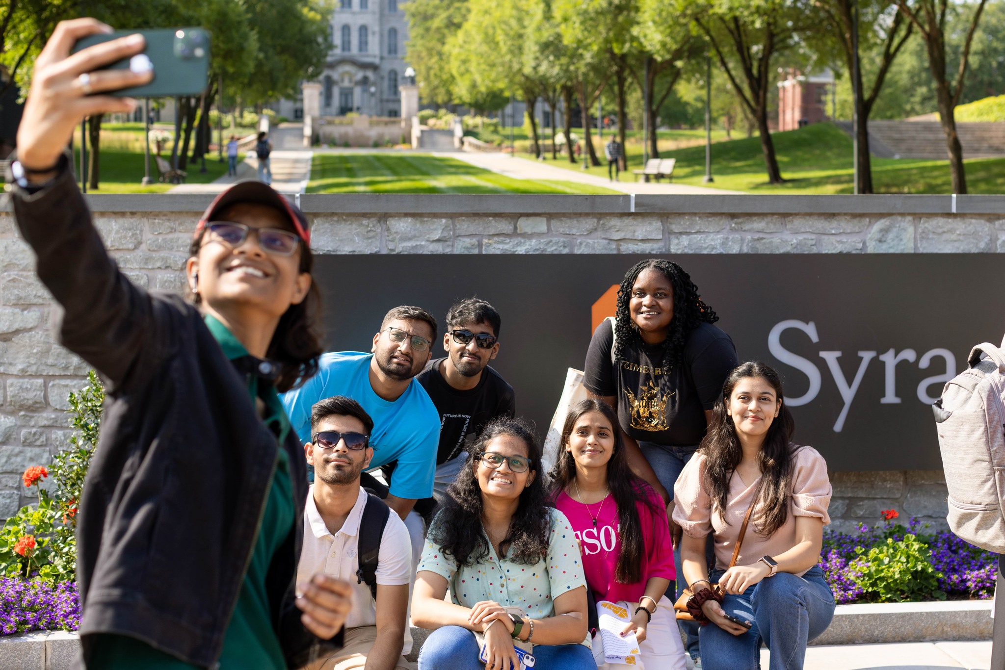 Someone takes a selfie with a large group of people.