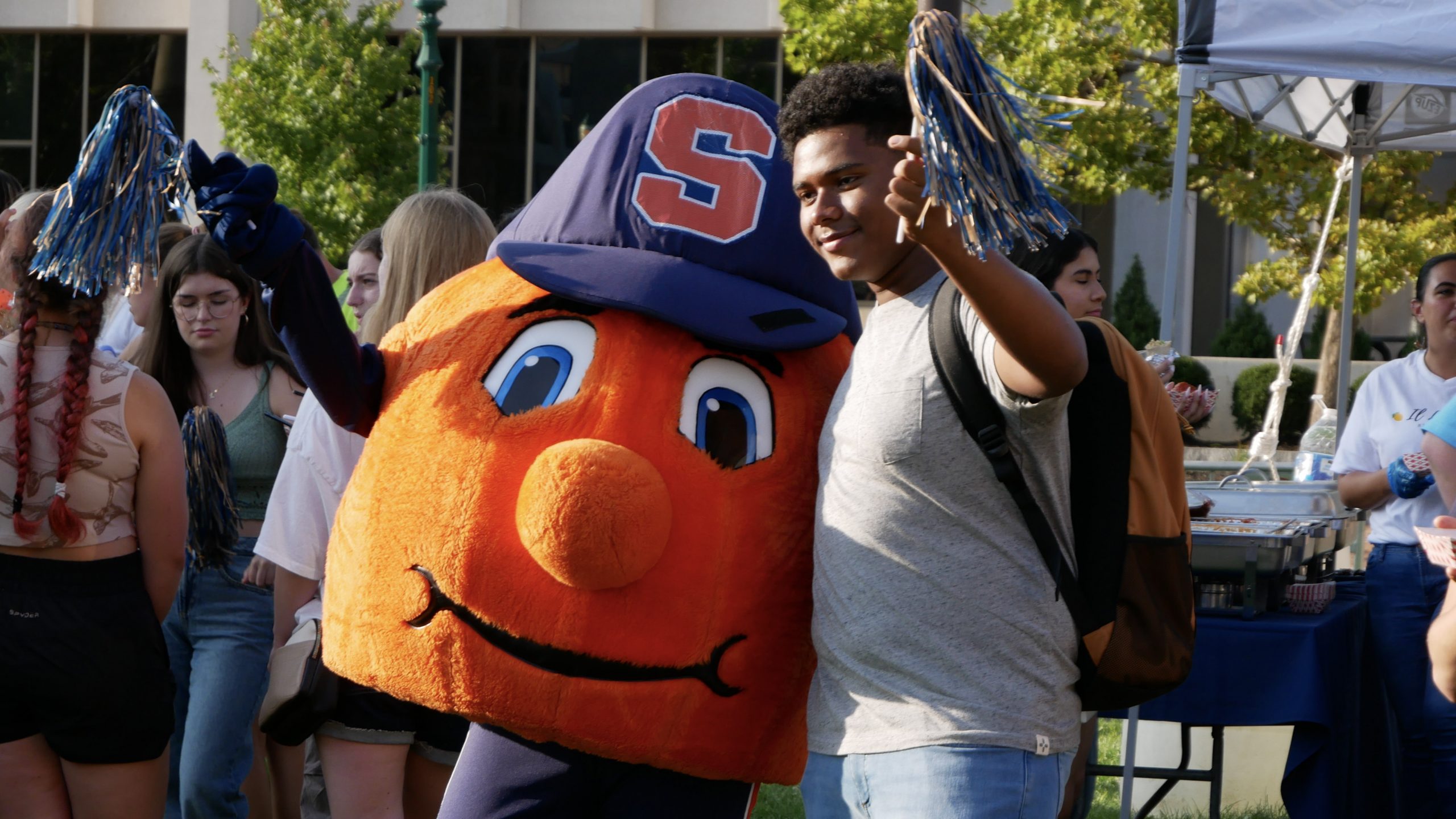 Otto and a student take a photo together