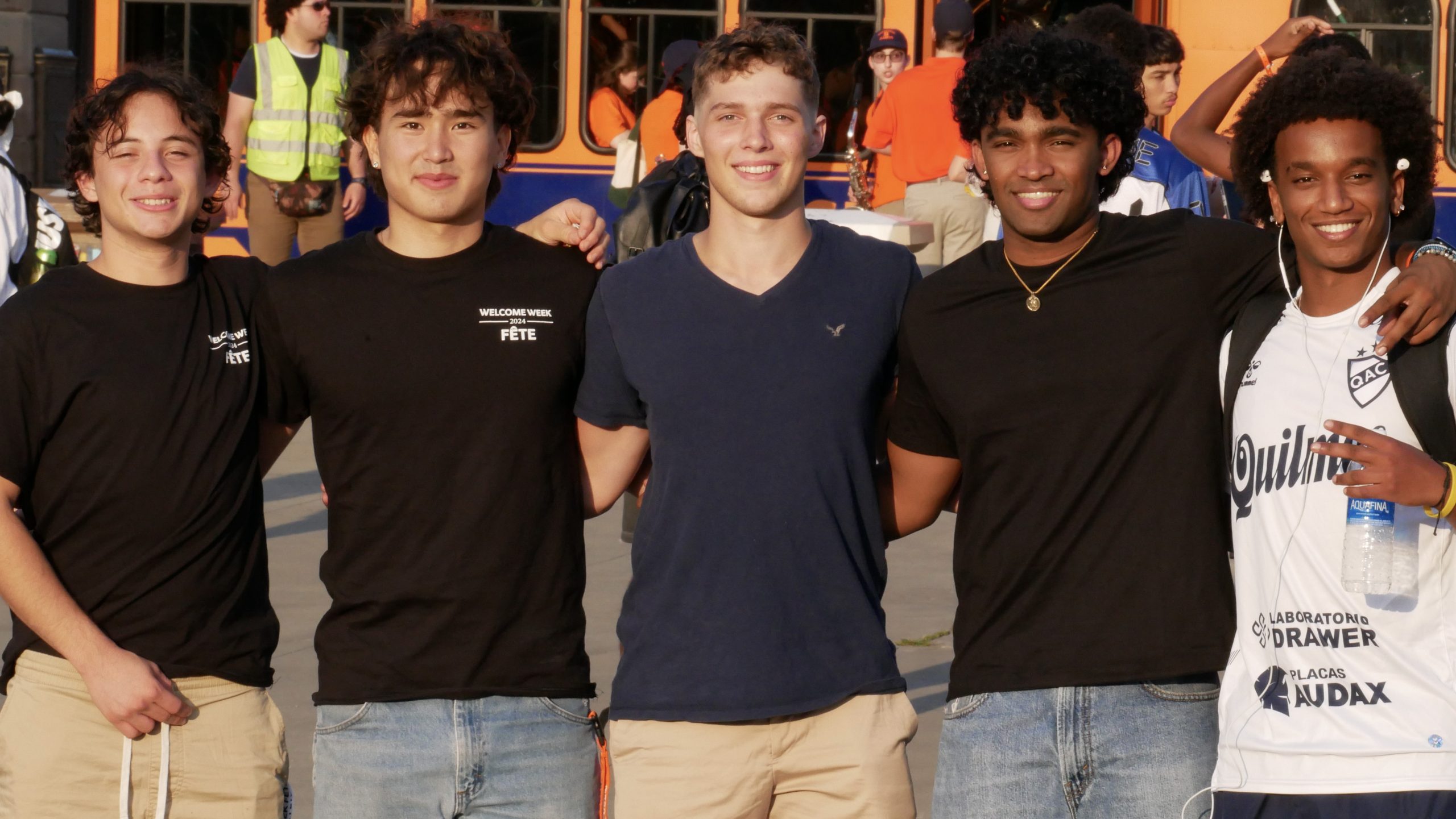 Five students stand together for a photo