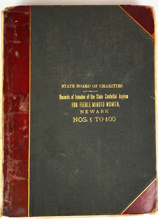 a black book with red binding and gold type title