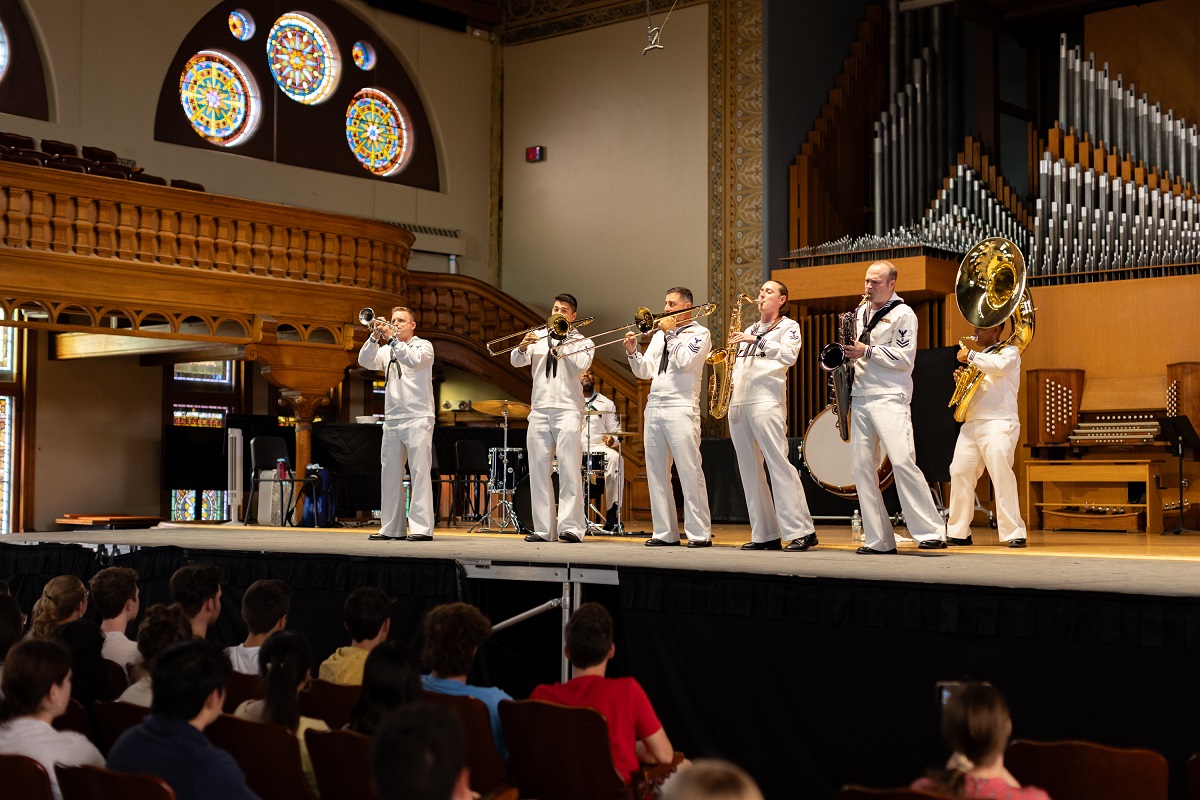 people playing musical instruments on stage