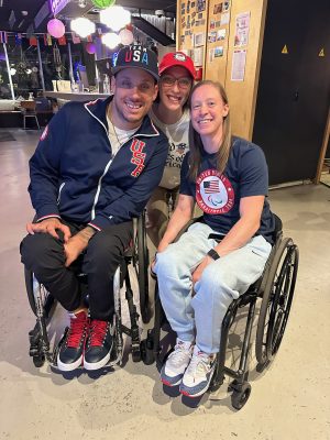 Sport management major Livia McQuade with U.S. athletes at Paralympics. 