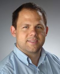 young man looking at camera with friendly expression