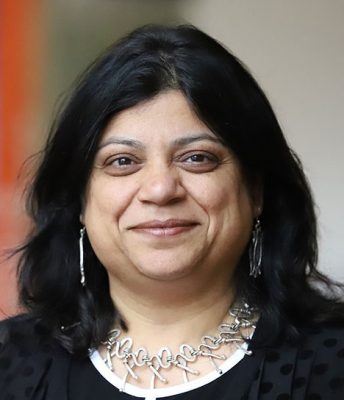 woman with long dark hair smiling