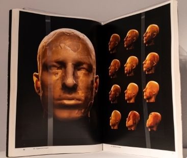 black background image with multiple copper-colored figures of head shapes opposite one large depicton of a man's head