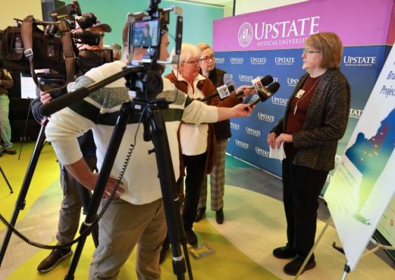 Social Work Professor Maria Brown interviewed by reporters.