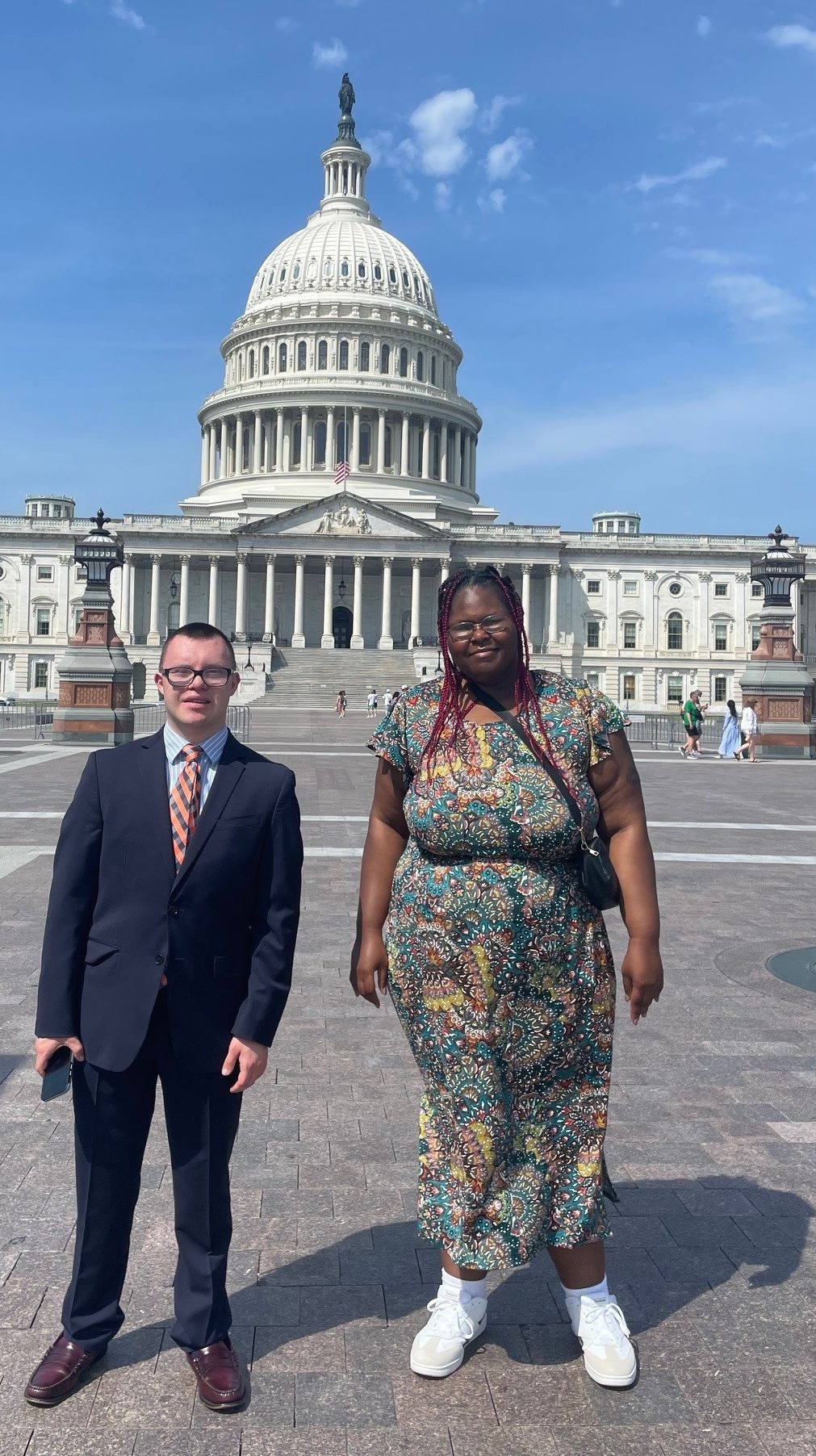 Two InclusiveU students pose in front of the United States Capitol.