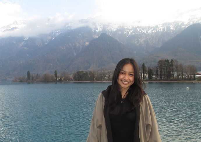 person standing in front of mountain lake