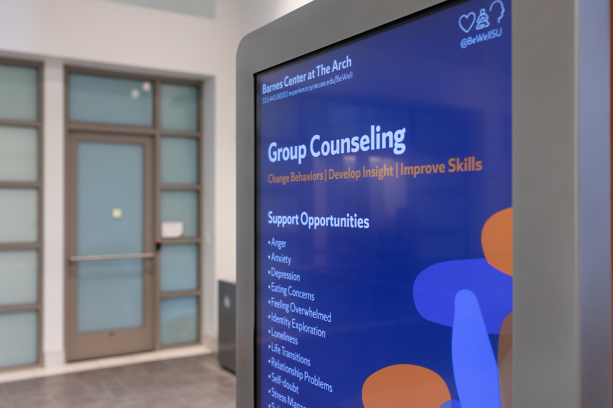 Digital screen displaying Group Counseling and Support Opportunities information at Barnes Center at The Arch, with focus on mental health topics like anger, depression, and anxiety.