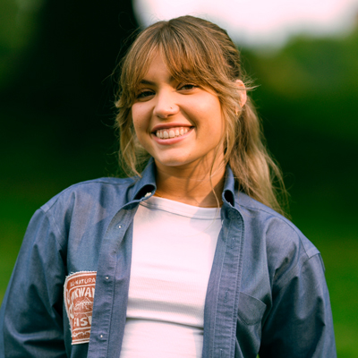 A woman smiles while posing for a headshot.