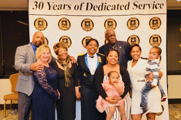 Teresa Cross '99, center, with her family