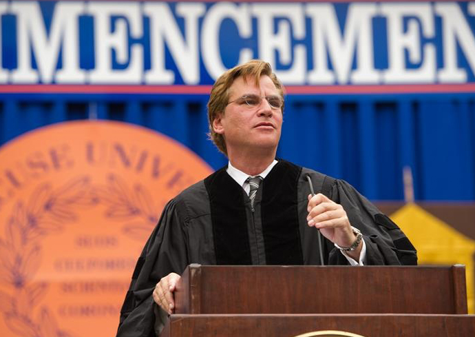 person at podium on Commencement stage