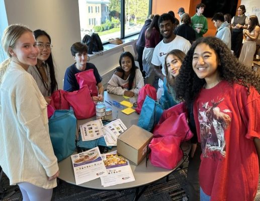 group of young students packaging food supplies