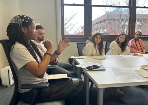 Members of Engaged Humanities Network research team at a meeting.