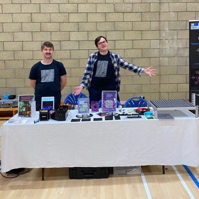 Syracuse University postdoctoral researcher Graeme Eddolls (left) and his collaborator Andrew Spencer (right) presenting their research on gravitational waves during the Orkney International Science Festival.