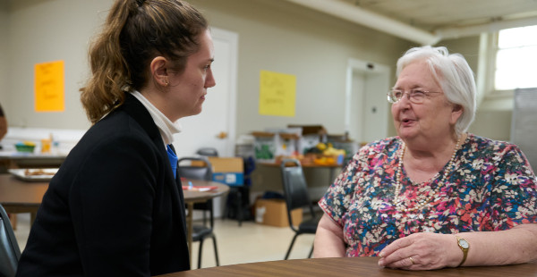 Katarina Sako '24 speaks with a participant in the recent Age Well Days event