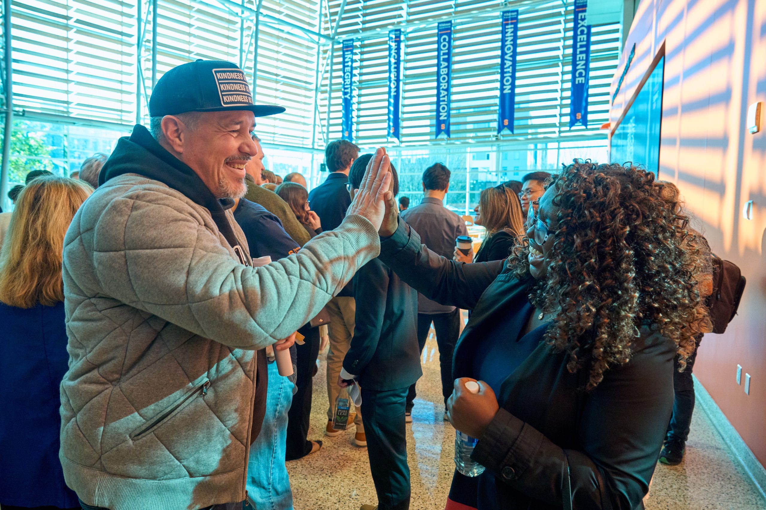 Two people high-fiving, creating a joyful atmosphere.