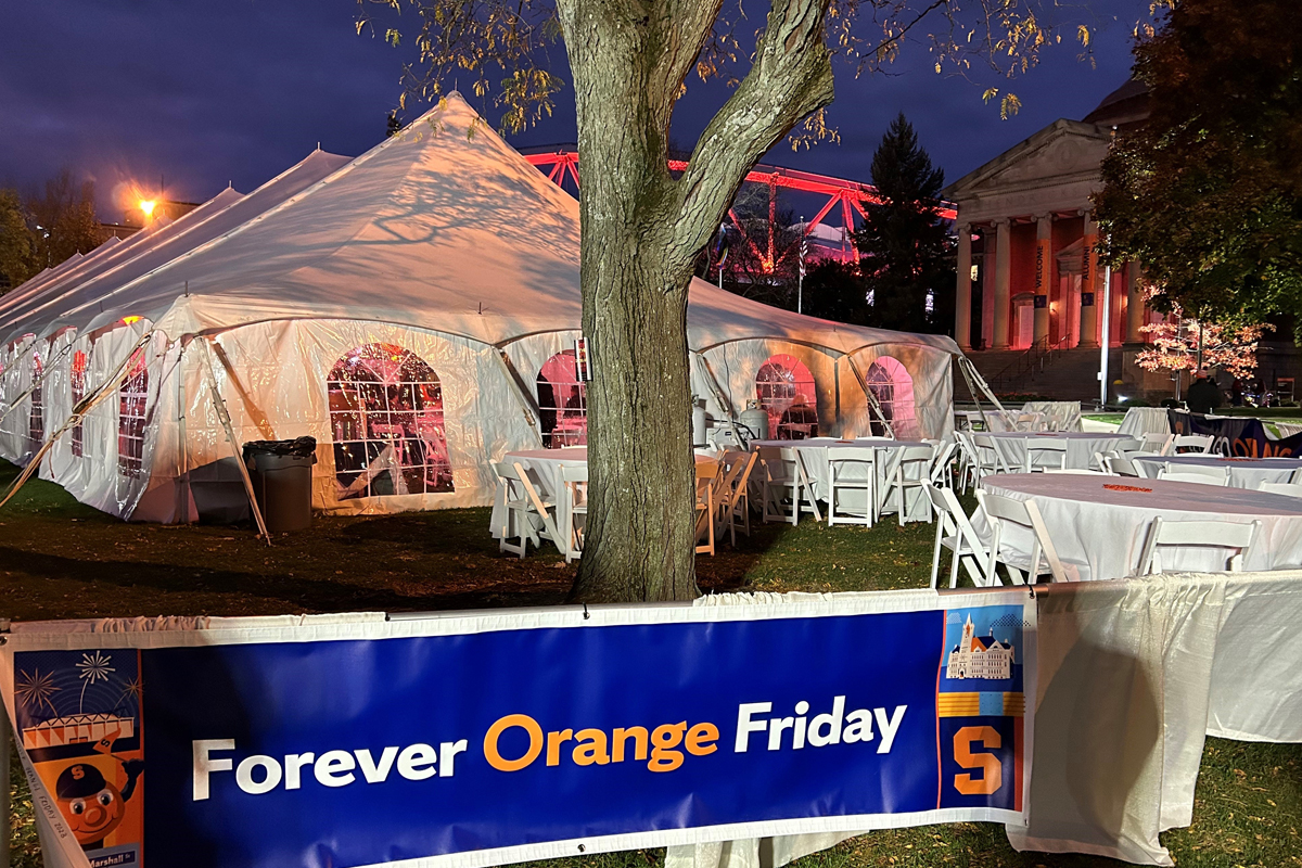 A Forever Orange Friday sign outside tents on the Syracuse University Quad.