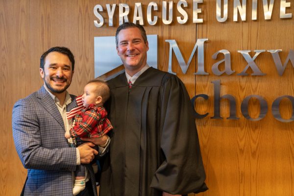 Tomas Olivier with his daughter, Sofia, and Judge Patrick Radel