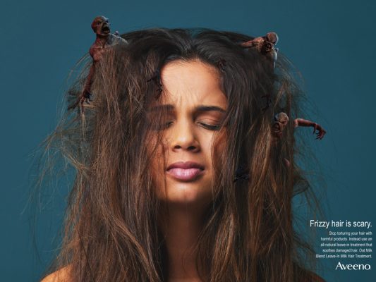 A woman with frizzy hair.