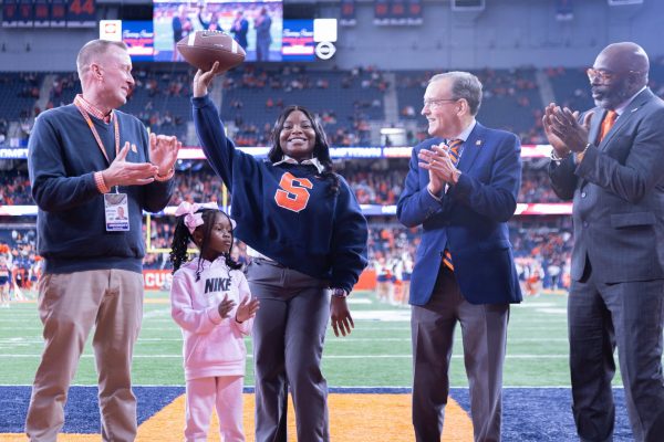 Benetta Dousuah being honored as the Hometown Hero at the SU vs. Connecticut game