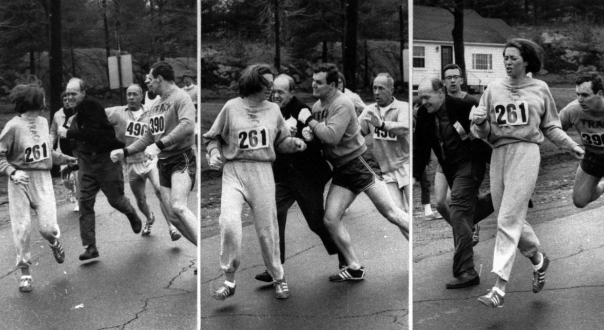 A woman is attacked while running the Boston Marathon before her boyfriend pushes the race director out of the way.