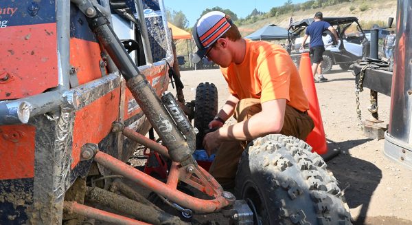 A student works on an off-road vehicle.