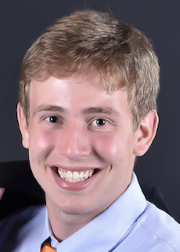 young man smiling and looking at camera