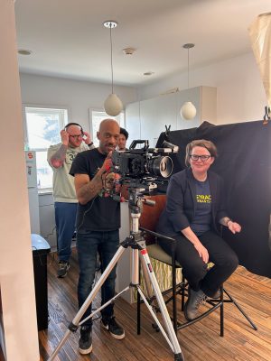 Gretchen Purser, associate professor of sociology, is shown during filming with producer and photography director Franklin Thompson of August Fifth Productions.