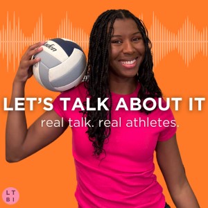 person standing while holding volleyball on shoulder