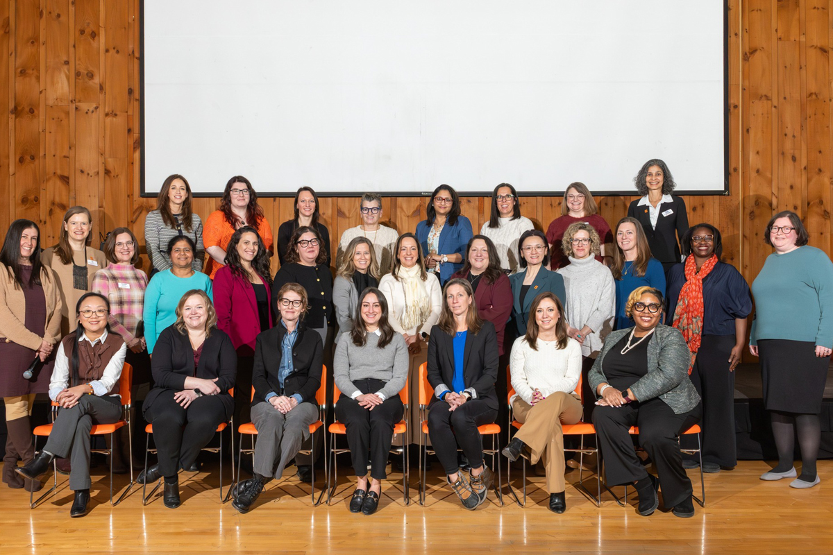 A group of women pose for a photo as part of the Women in Leadership Initiative.