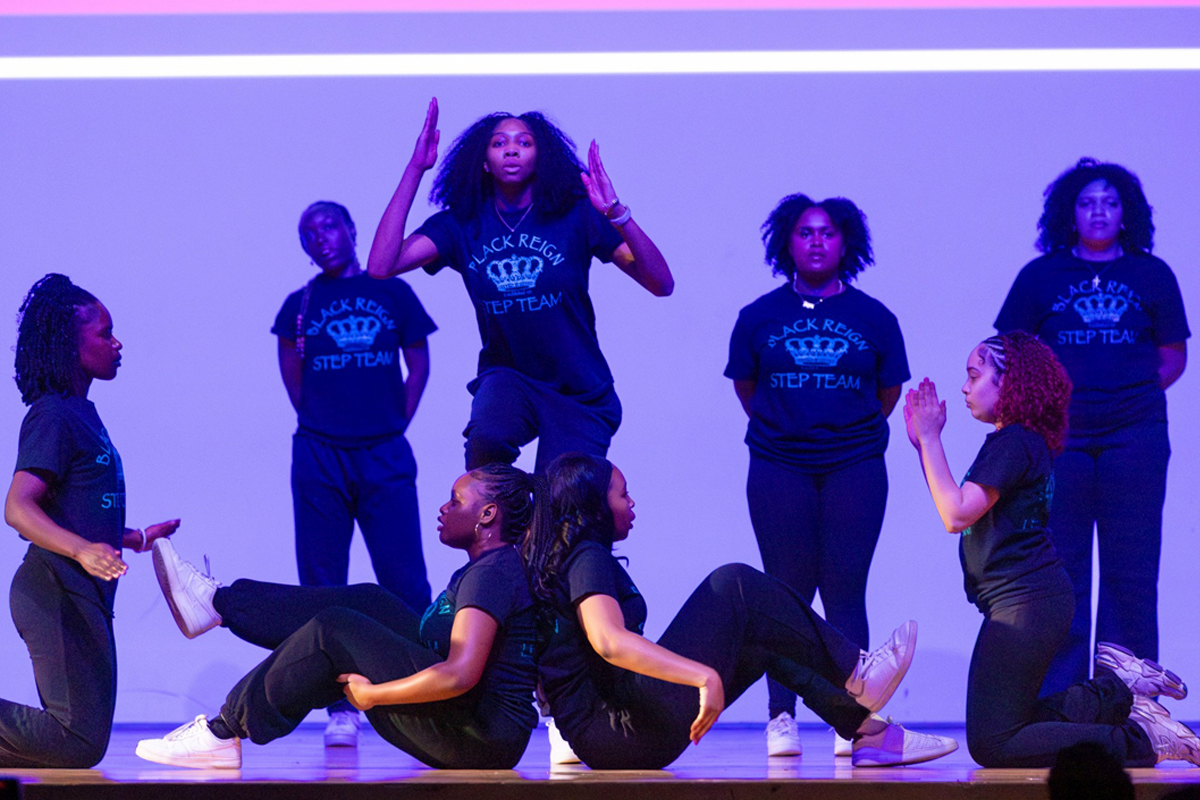 Student members of Syracuse University's Black Reign Step Team perform during the Black History Month Kickoff event.