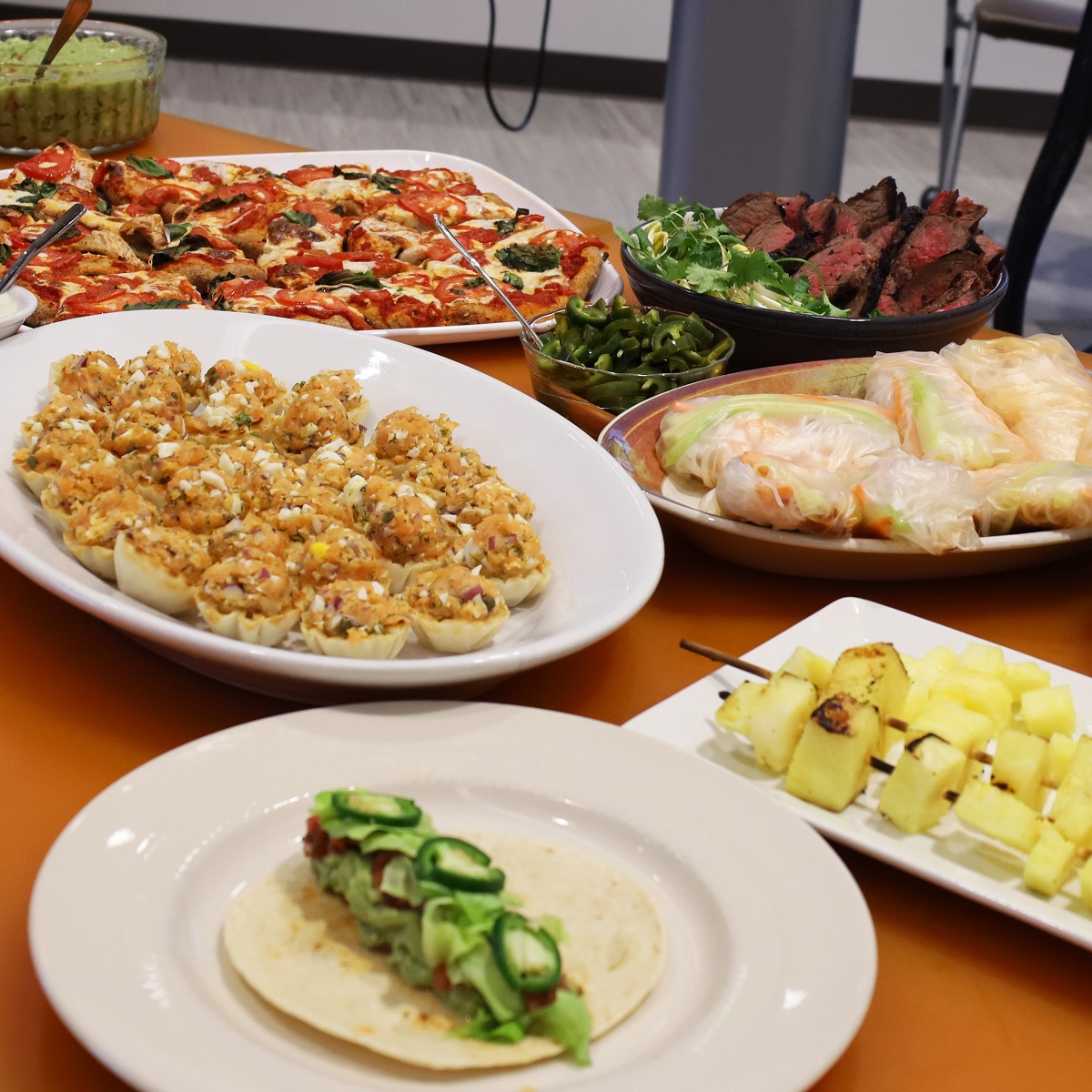 several food dishes displayed on a table