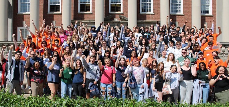 rows of students standing outside building