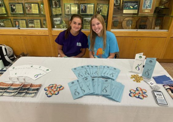 Taylor Ratliff '28 and friend tabling on mental health at Fayetteville-Manlius High School