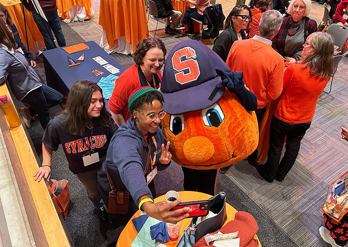 SU mascot Otto with various people celebrating Orange Central