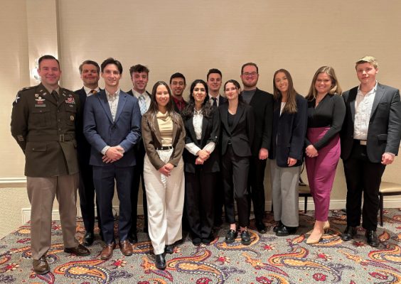 International Model NATO students and advisors pose for a group photo