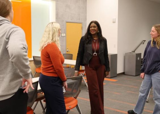 Falk College 2025 Convocation Speaker Benita Fitzgerald Mosley meeting with students.