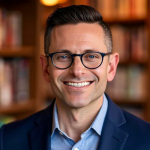 Person smiling at camera with library in background.