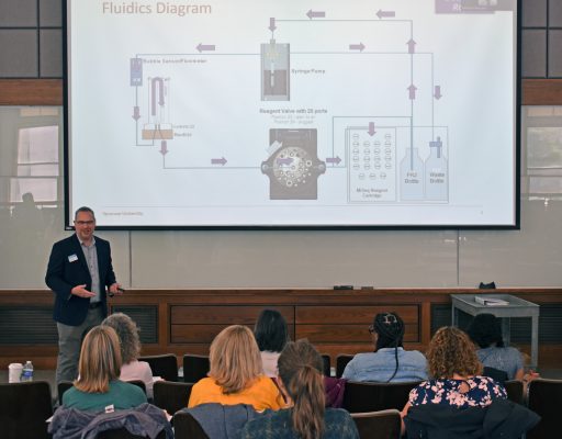 Forensics professor Jamie Crill providing “under the hood” information on how the DNA sequencing system operates.