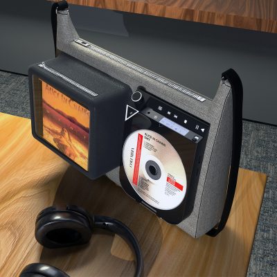 Modern, stylish bag with an integrated CD player and a screen displaying the album cover of 'Alice in Chains.' The CD player is playing a disc labeled 'Alice in Chains – Dirt.' The bag has a top zipper and is placed on a wooden surface, with black headphones resting nearby.