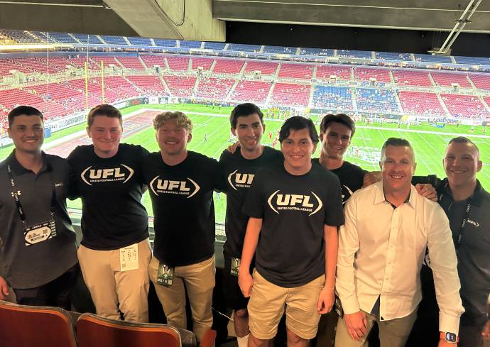 Falk College sport analytics students at the UFL championship game.